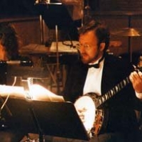 Mary Duren and I playing with the Dallas Lyric Opera. Looks like a Far Side cartoon…