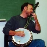 Showing how to play a chord that has more notes than you have fingers. Or I’m playing the snot out of it! That’s the great Stealth banjo I let get away…Dang…
