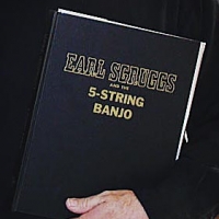 If you look closely you’ll notice that “Scruggs” is spelled “Sgruggs.” It’s that way on the dust jacket and flyleaf too. Alan Munde owns a soft cover one misspelled the same way.