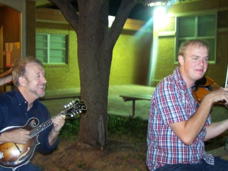 Nate Lee and me picking at Camp Bluegrass. Nate wears a hat a lot now.