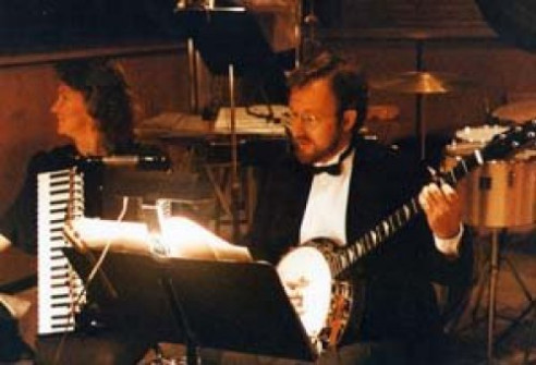 Mary Duren and I playing with the Dallas Lyric Opera. Looks like a Far Side cartoon…