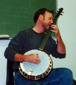 Showing how to play a chord that has more notes than you have fingers. Or I’m playing the snot out of it! That’s the great Stealth banjo I let get away…Dang…