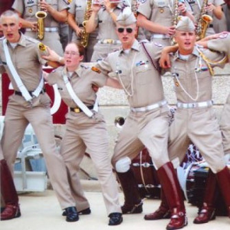 Hannah in the Aggie Band. She played percussion. Fish don’t get to wear hats… or boots… 2006.