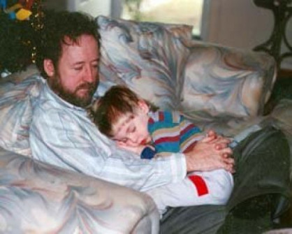 My son Ian and me resting our eyes. He's about six feet tall now.
