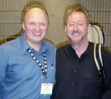 Jim Mills and me chillin’ at IBMA 2008. I could use a hat…